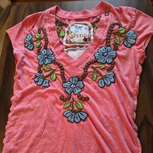 pink short-sleeve top, with delicate blue embroidered flowers Joystick